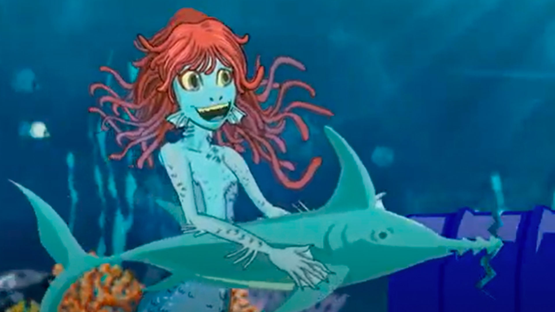 sirena sumergida en el mar con un tiburón serrucho 