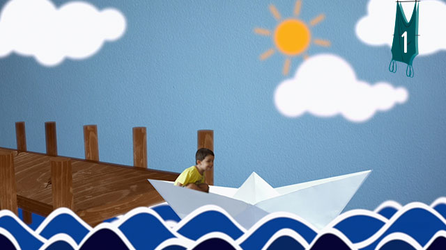 Un niño dentro de un barco de papel gigante en un océano imaginario