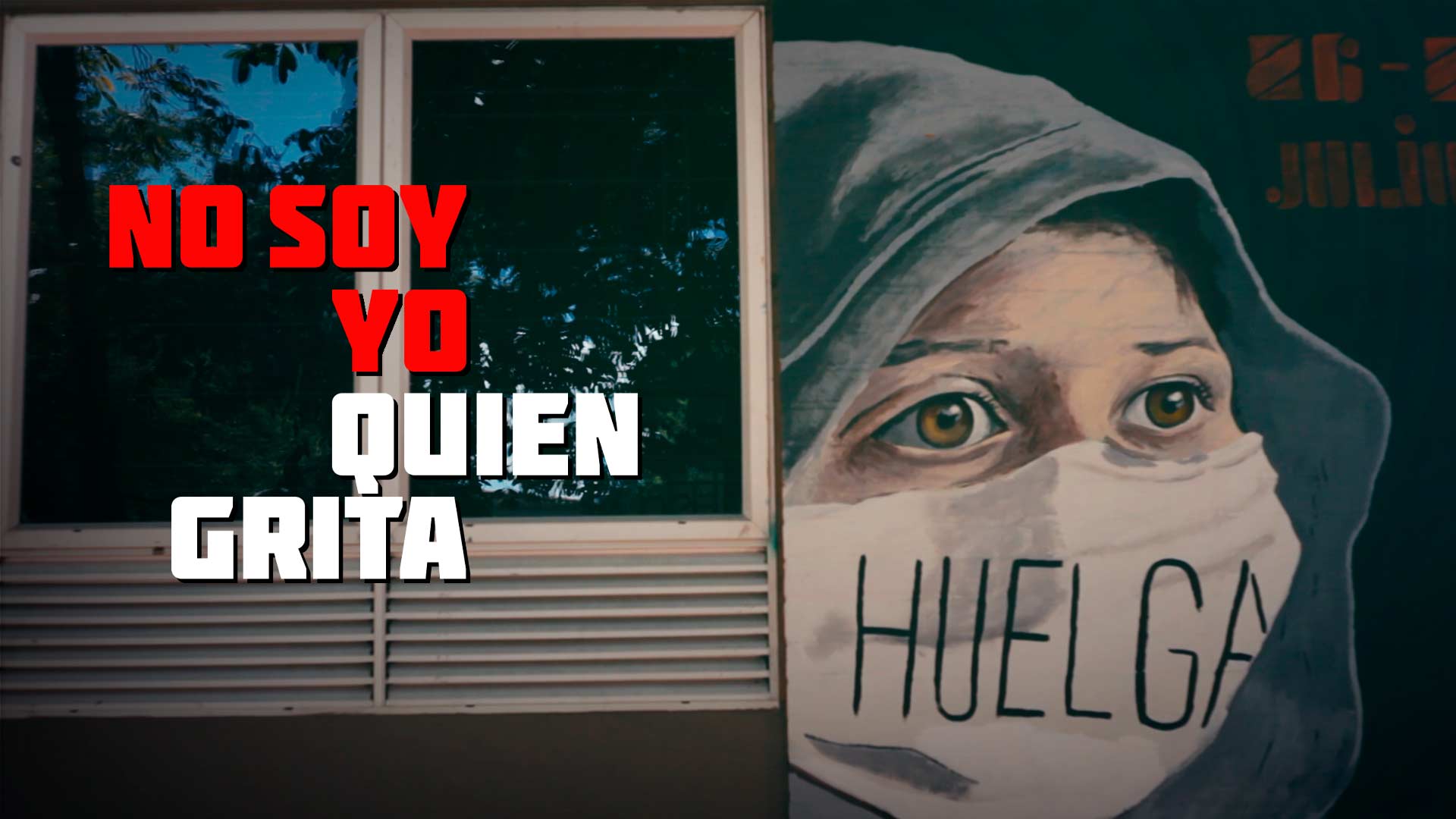 Graffiti de persona con capucha y tapabocas en el que dice: huelga